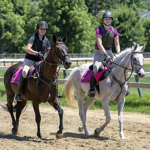 Jenna S. Nuth riding Dark Delight & Viviana Vento riding Celtic Class at Pimlico's Canter for the Cause